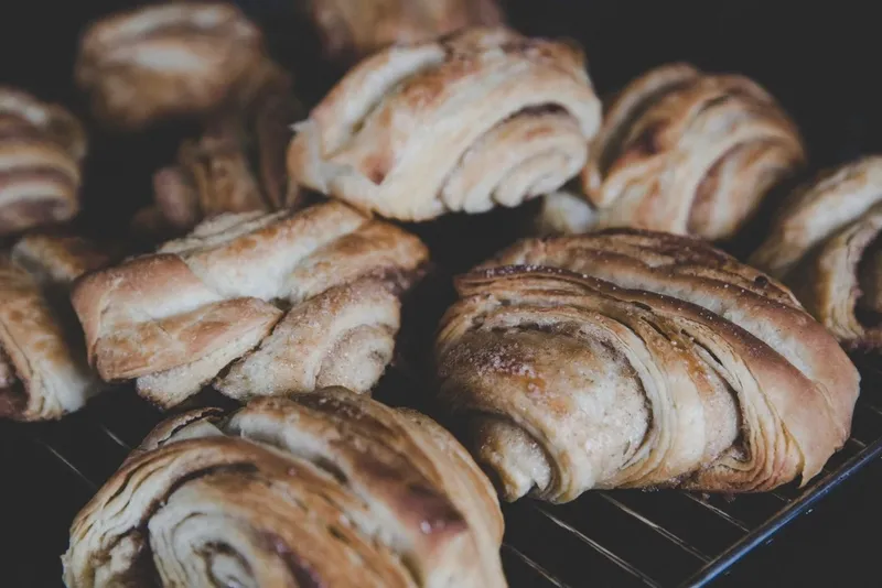 Twisted cinnamon buns on a cooling rack