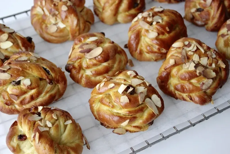 Almond buns on a cooling rack